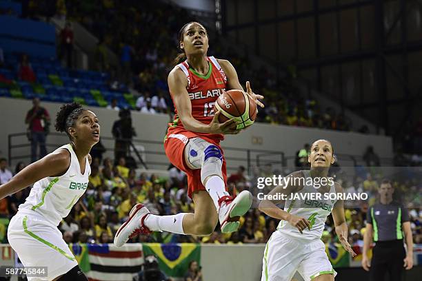 Belarus' guard Lindsey Harding jumps for the basket by Brazil's point guard Adriana Moises during a Women's round Group A basketball match between...