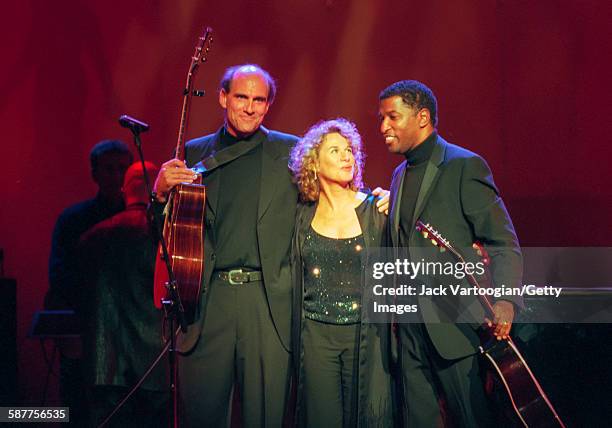 From left, American Pop musicians James Taylor and Carole King, and R&B musician Babyface , take a bow after their performance in the Theater at...