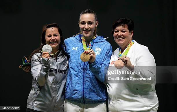 Silver medalist Monica Karsch of Germny, gold medalist Anna Korakaki of Greece, and Heidi Diethelm Gerber of Switzerland pose on the podium during...
