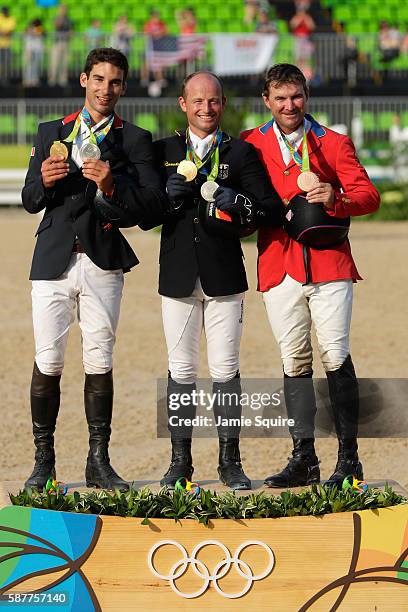 Silver medalist Astier Nicolas of France, Gold medal medallist Michael Jung of Germany and bronze medallist Phillip Dutton of the United States pose...