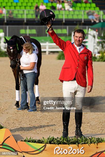 Bronze medallist Phillip Dutton of the United States pose during the medal ceremony for the eventing team Individual final on Day 4 of the Rio 2016...