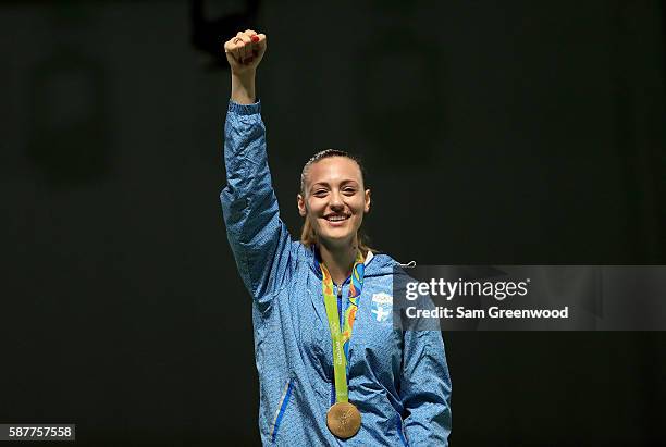 Gold medalist Anna Korakaki of Greece smiles on the podium during the medal ceremony for the Women's 25m pistol event on Day 4 of the Rio 2016...