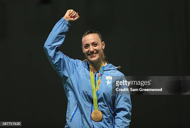 Gold medalist Anna Korakaki of Greece smiles on the podium during the medal ceremony for the Women's 25m pistol event on Day 4 of the Rio 2016...