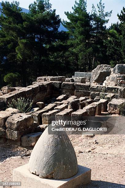The Omphalos, conical navel of the world, in the ruins of Delphi , Greece. Greek civilisation, 4th century BC.