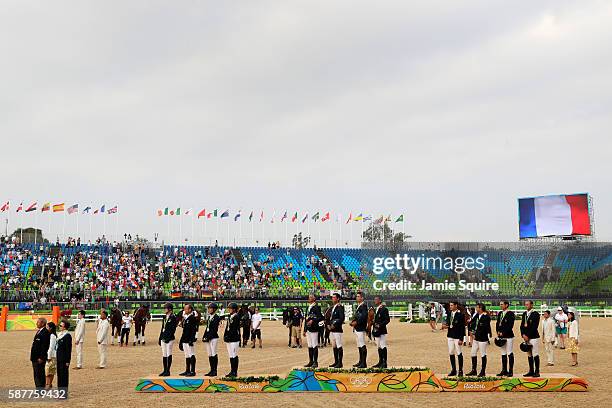 Silver medalists Julia Krajewski, Sandra Auffarth, Ingrid Klimke and Michael Jung of Germany, Gold medal medalists Karim Laghouag, Thibaut...