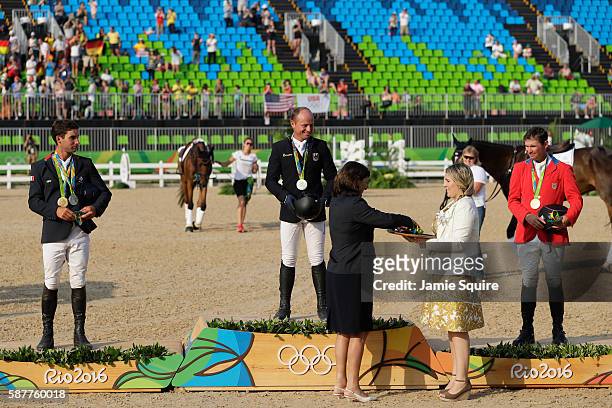 Silver medalist Astier Nicolas of France, Gold medal medallist Michael Jung of Germany and bronze medallist Phillip Dutton of the United States pose...