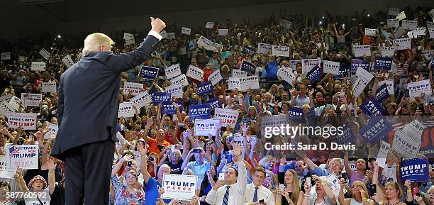 Republican presidential candidate Donald Trump thumbs-up the crowd during a campaign event at Trask Coliseum on August 9, 2016 in Wilmington, North...