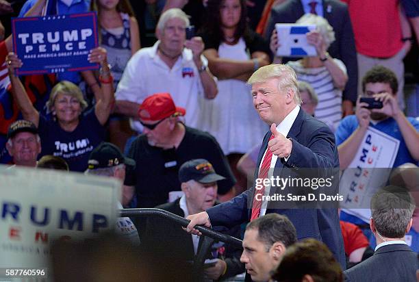 Republican presidential candidate Donald Trump thumbs-up the crowd during a campaign event at Trask Coliseum on August 9, 2016 in Wilmington, North...