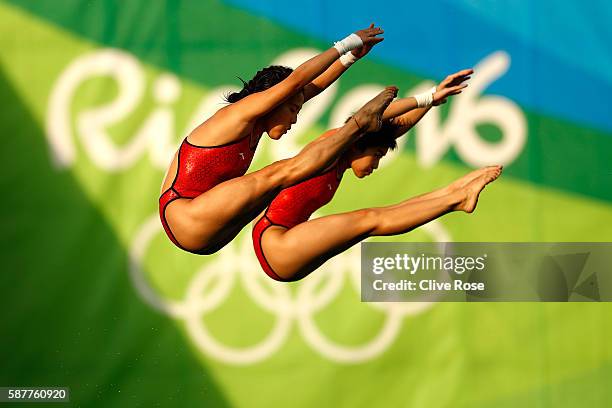 Ruolin Chen and Huixia Liu of China compete in the Women's Diving Synchronised 10m Platform Final on Day 4 of the Rio 2016 Olympic Games at Maria...