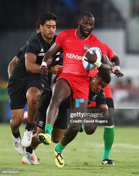 Dennis Ombachi of Kenya is tackled by Akira Ioane of New Zealand during the Men's Rugby Sevens Pool C match between New Zealand and Kenya on Day 4 of...