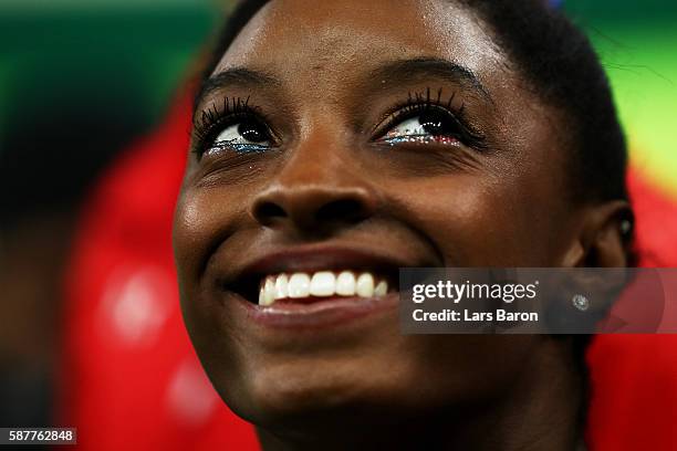 Simone Biles of the United States looks on during the Artistic Gymnastics Women's Team Final on Day 4 of the Rio 2016 Olympic Games at the Rio...