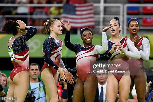 Lauren Hernandez, Madison Kocian, Simone Biles, Alexandra Raisman and Gabrielle Douglas of the United States celebrate winning the gold medal during...