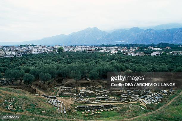 Ruins of the theatre at Sparta, with the modern town behind it and Mount Taygetus in the background, Peloponnese, Greece. Roman civilisation, 1st...