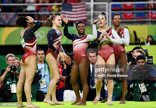 Lauren Hernandez, Madison Kocian, Simone Biles, Alexandra Raisman and Gabrielle Douglas of the United States celebrate winning the gold medal during...