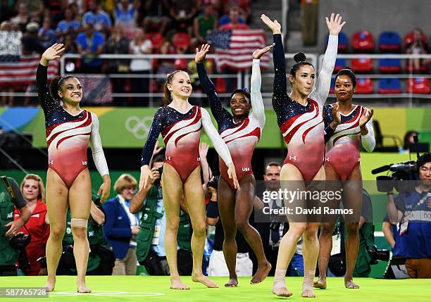 Lauren Hernandez, Madison Kocian, Simone Biles, Alexandra Raisman and Gabrielle Douglas of the United States wave to fans to celebrate winning the...