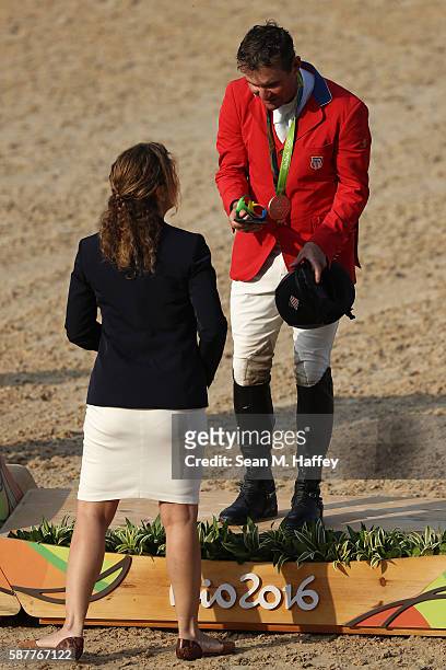 Bronze medallist Phillip Dutton of the United States pose during the medal ceremony for the eventing team Individual final on Day 4 of the Rio 2016...