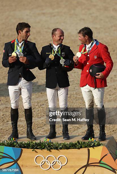 Silver medalist Astier Nicolas of France, Gold medal medallist Michael Jung of Germany and bronze medallist Phillip Dutton of the United States pose...