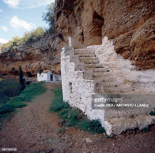 Steps into the doline containing the cave churches of Agios Georgios and Metamorphosis, Didyma, Argolis, Greece.
