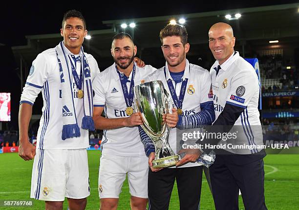Zinedine Zidane , Coach of Real Madrid poses with son Luca, Raphael Varane and Karim Benzema after the UEFA Super Cup match between Real Madrid and...