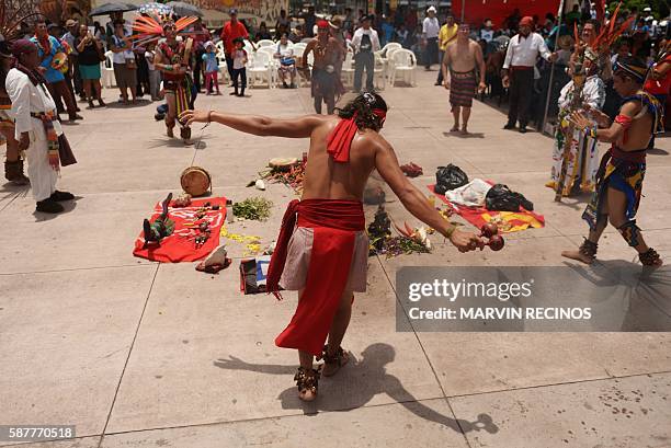 Members of the Nahua Pipil indigenous people participate in a ceremony commemorating the International Day of the World's Indigenous Peoples at El...