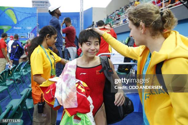 Gold medallist China's Liu Huixia reacts after winning the Women's Synchronised 10m Platform Final with teammate Chen Ruolin during the diving event...