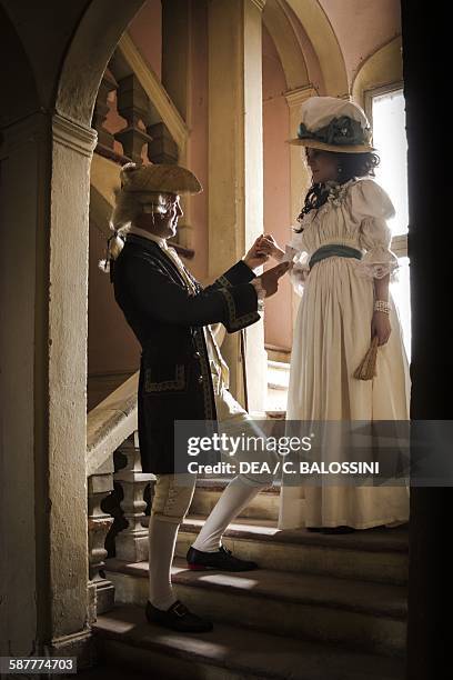 Gallant scene in the court of Marie Antoinette, queen consort of France . France, second half 18th century. Historical reenactment.