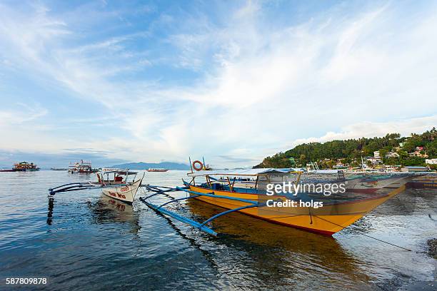 sabang beach in puerto gallera, philippines - gallera stock pictures, royalty-free photos & images