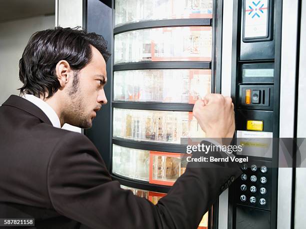 frustrated businessman at vending machine - work vending machine stock pictures, royalty-free photos & images