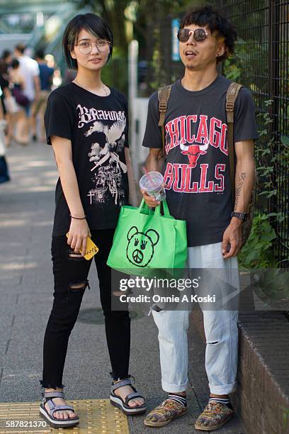 Ai Miyata and Kazuki Yamashiro are seen on Meiji St. On August 07, 2016 in Tokyo. Ai Miyata has a henna tattoo, wearing a black band t-shirt by...