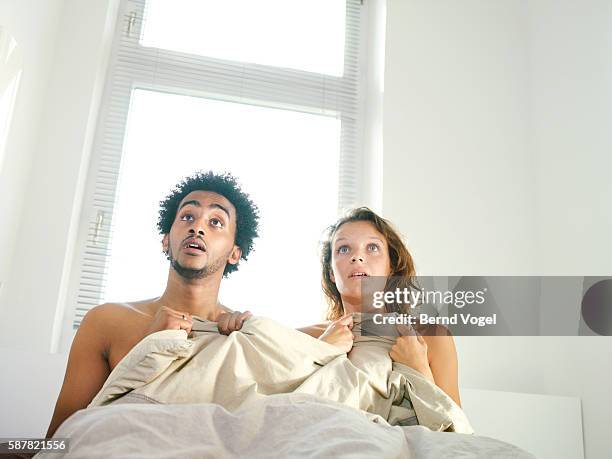 man and woman with surprised expression - affairs stockfoto's en -beelden