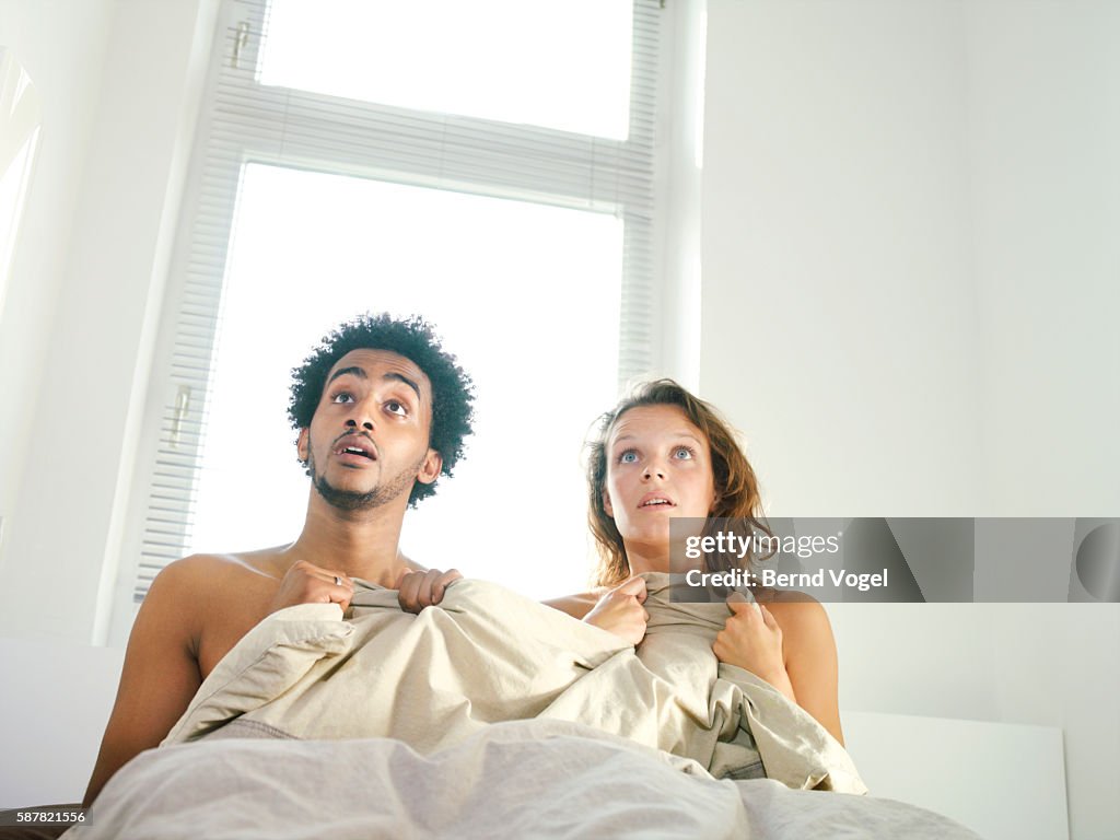 Man and woman with surprised expression