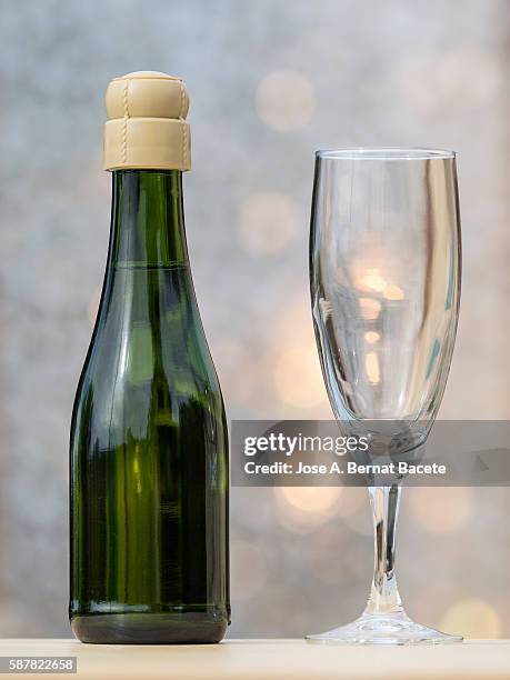 minibar bottle and glass of champagne - champagne fountain stockfoto's en -beelden