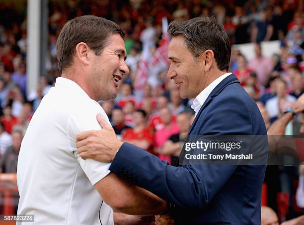 Philippe Montanier, Head Coach of Nottingham Forest embraces Nigel Clough, Manager of Burton Albion during the Sky Bet Championship match between...