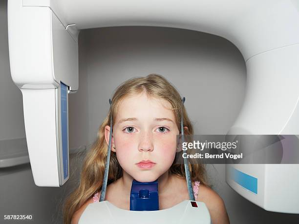 girl receiving dental examination - dentist archival stock pictures, royalty-free photos & images