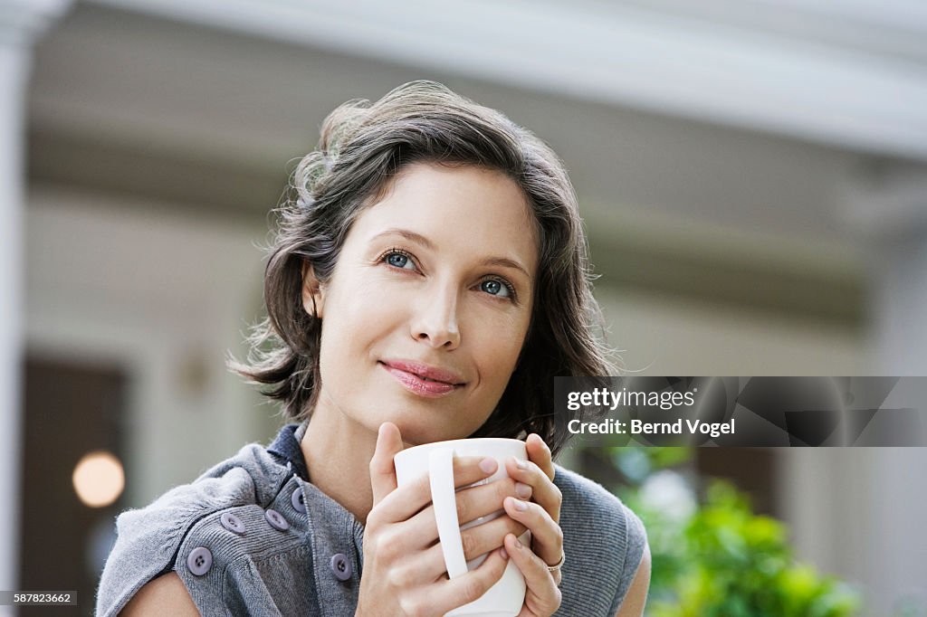 Woman drinking from coffee mug