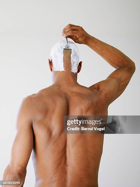 man shaving his head - shaving head stock pictures, royalty-free photos & images