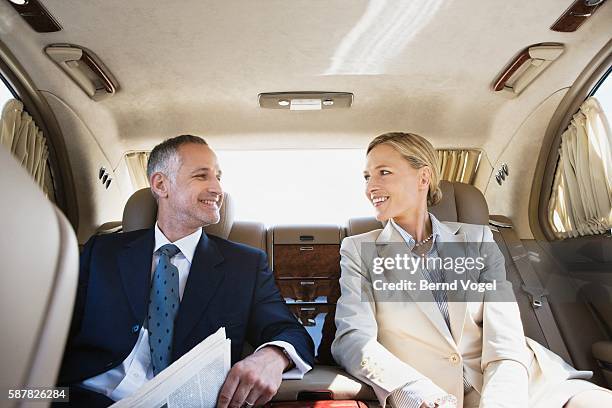 business colleagues in limousine - office romance stock pictures, royalty-free photos & images