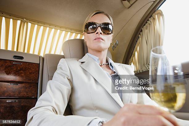 executive with champagne limousine - arrogant stock-fotos und bilder