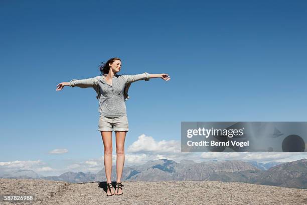 young woman outdoors - arm outstretched stock pictures, royalty-free photos & images