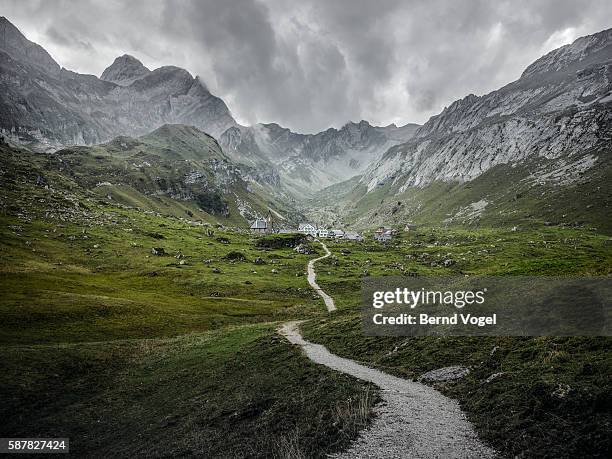 trail to the village - mountain path stock pictures, royalty-free photos & images