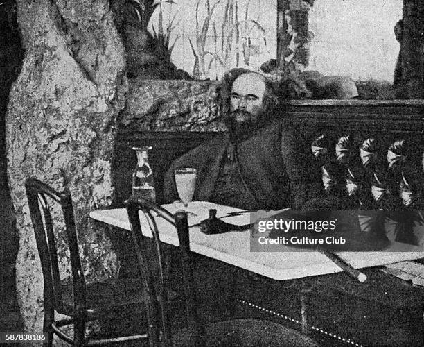 Paul Verlaine - portrait in front of a glass of absinthe at the Café Procope, Paris, France.French poet, 1844