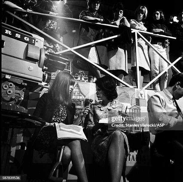 Members of the studio audience watch as a cameramen films presenter Cathy McGowan on the TV show Ready Steady Go, Wembley Studios, London, 1965.