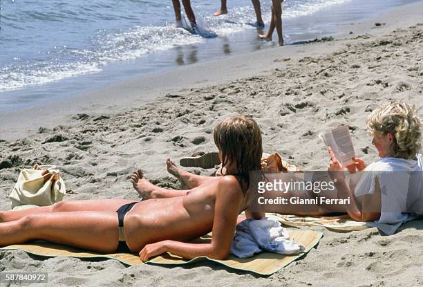 Topless on the beach in Marbella Malaga, Andalusia, Spain. .