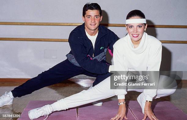 The Spanish bullfighter Vicente Ruiz 'El Soro' doing gymnastics with his wife Suzette Foyos, Valencia, Spain. .
