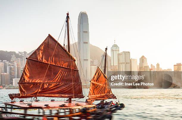 hong kong harbour cruises on a red-sail junk boat - hong kong junk boat stock pictures, royalty-free photos & images