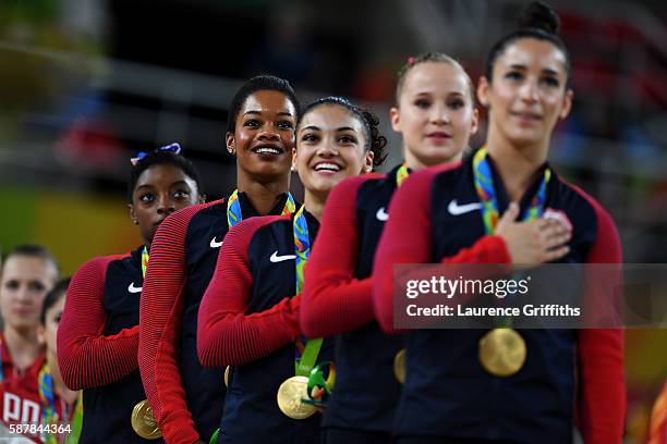 Gold Medalists Simone Biles, Gabrielle Douglas, Lauren Hernandez, Madison Kocian and Alexandra Raisman of the United States stand on the podium for...