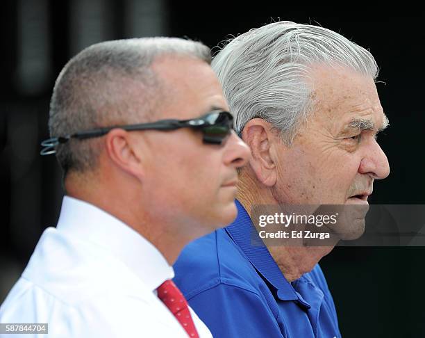 Kansas City Royals' general manager Dayton Moore and owner David Glass watch the Royals take batting practice prior to a game against the Chicago...