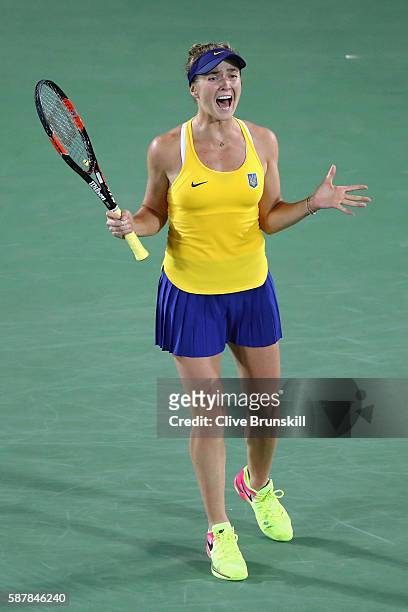 Elina Svitolina of Ukraine reacts after defeating Serena Williams of the United States in a Women's Singles Third Round match on Day 4 of the Rio...