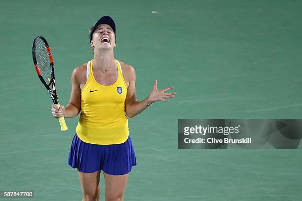 Elina Svitolina of Ukraine reacts after defeating Serena Williams of the United States in a Women's Singles Third Round match on Day 4 of the Rio...