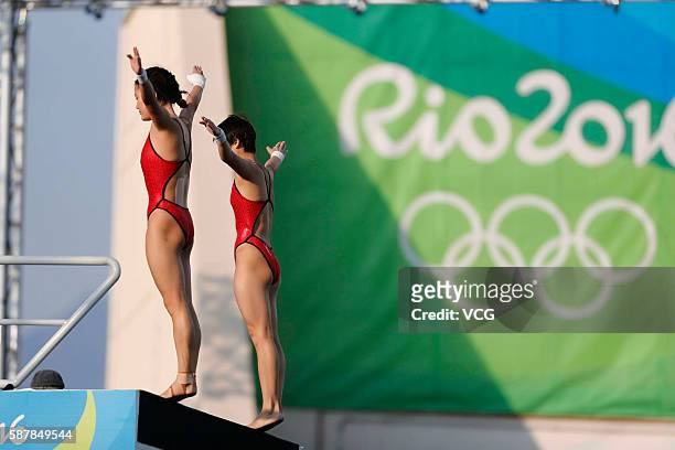 Ruolin Chen and Huixia Liu of China compete in the Women's Diving Synchronised 10m Platform Final on Day 4 of the Rio 2016 Olympic Games at Maria...